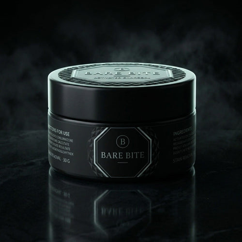 Front of the BARE BITE charcoal tooth powder jar with the octagon monogram label and directions panel